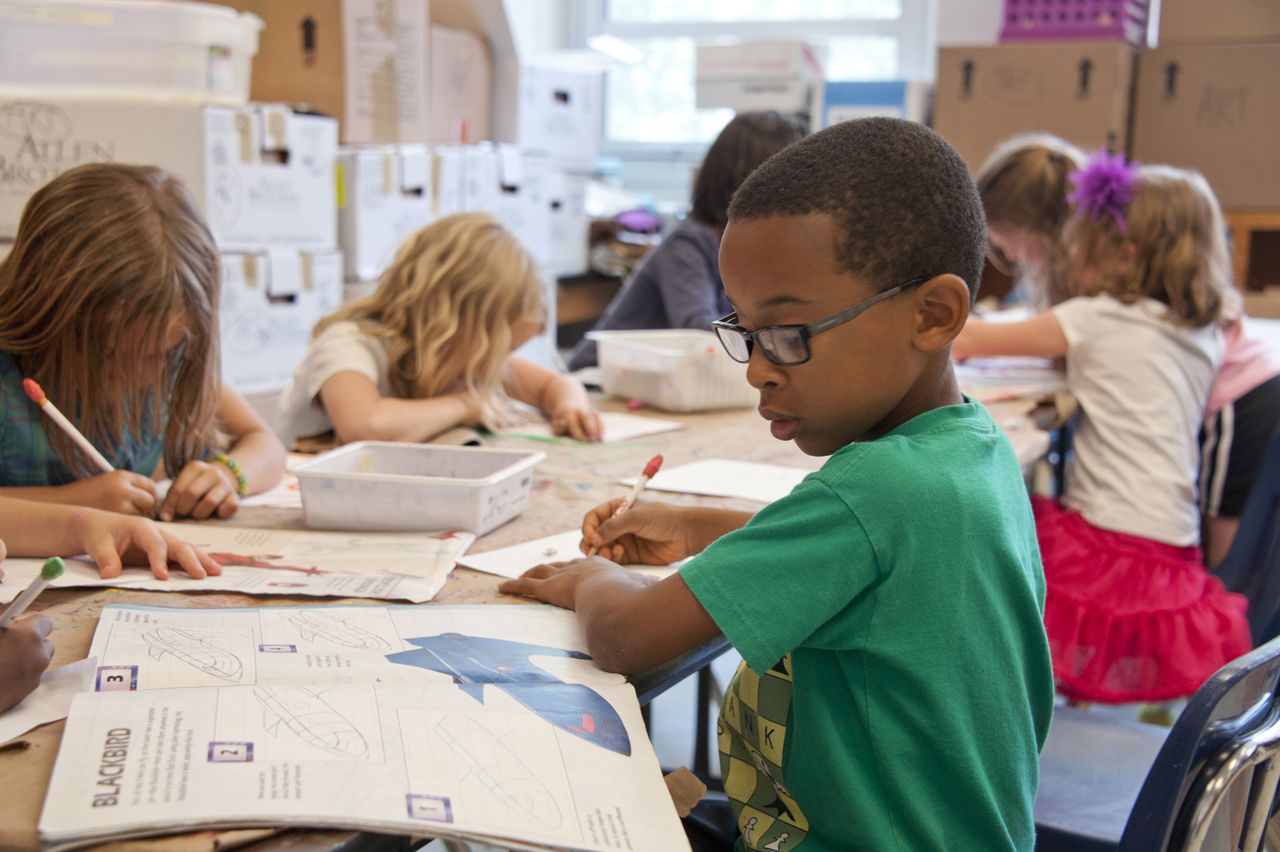 Young children learning together with their teacher